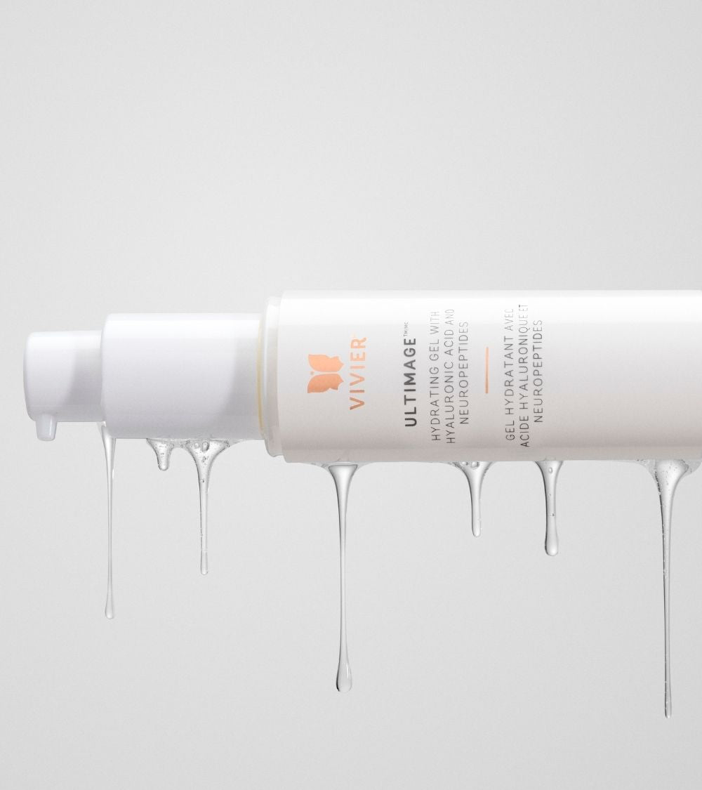 Tube of Vivier Ultimage skincare cream with product drips against a soft grey background
