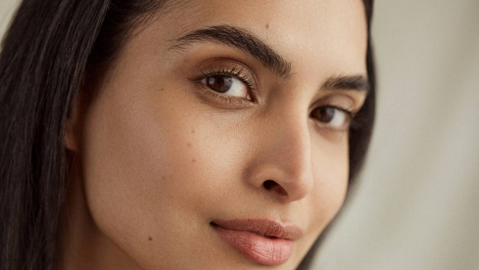Close-up beauty portrait highlighting smooth, radiant-looking facial skin and natural skin texture.