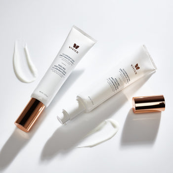 Vivier Illuminating Enzymatic Peel tubes displayed on a white surface with product texture and rose gold cap
